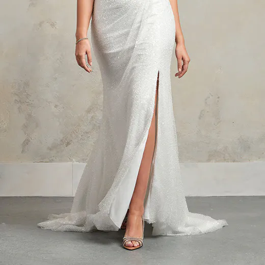 Ashley mermaid gown front view with slit, beaded detail, and subtle texture.
