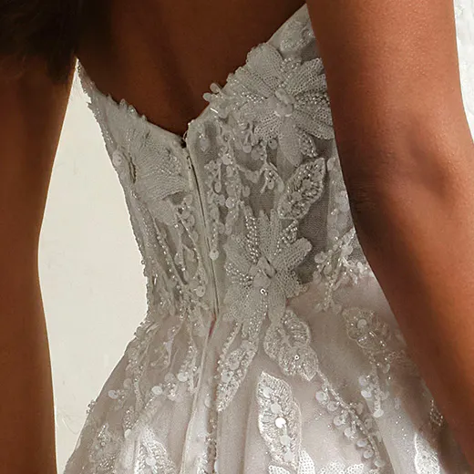 Maggie Sottero Caroline bridal gown back view with sequin lace and illusion details