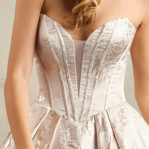Derrick Marie floral ballgown front view with textured bodice detail.