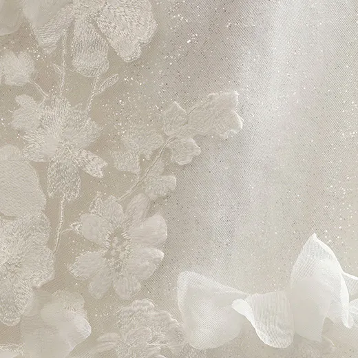 Delicate floral lace with sparkle detail on the Hayden wedding gown.