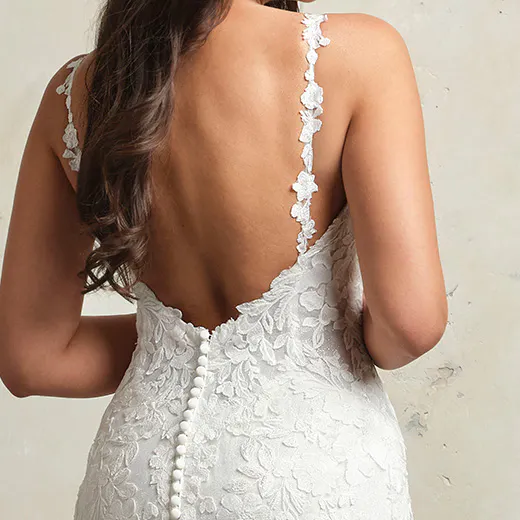 Hayden lace wedding gown back view with floral straps and button detail.