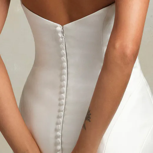 Leilani fit-and-flare dress back view with button detail.