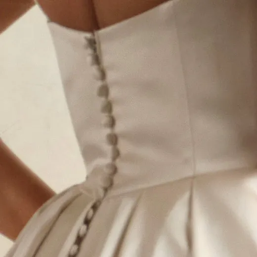 Selena Vida satin gown back view with button detail