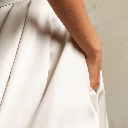 Selena satin wedding gown side view showing pocket detail.
