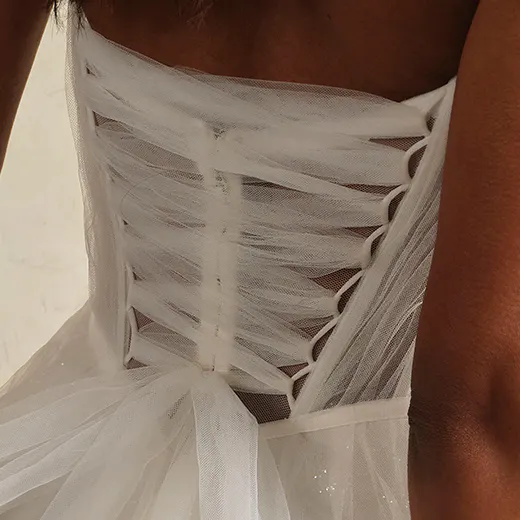 Maggie Sottero Allison back view showing lace-up tulle bodice.