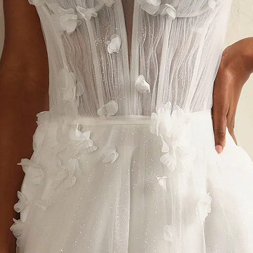 Maggie Sottero Allison close-up, floral details on tulle bodice, A-line wedding gown.