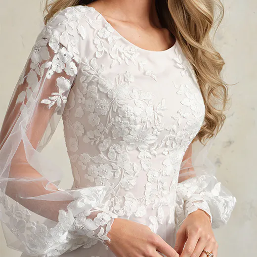 Rebecca Ingram Benicia front view floral lace bridal gown with sheer sleeves