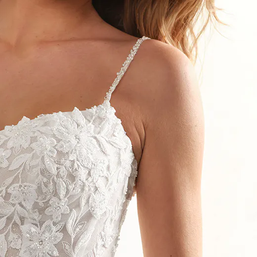 Catherine bridal dress front view with spaghetti straps and lace floral details.