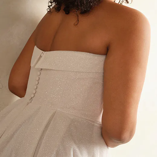 Soft A-Line Elizabeth back view, banded cuff detail, buttons, textured fabric.