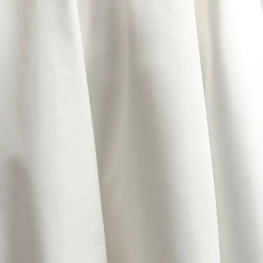 Ethelinda short wedding dress, close-up view of fabric layers.