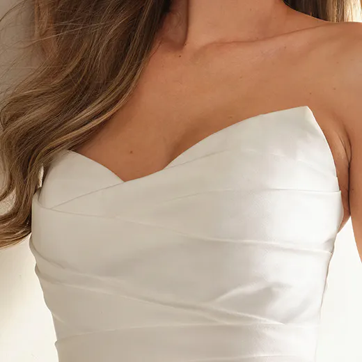 Ethelinda short wedding dress front view, strapless with ruched detailing.