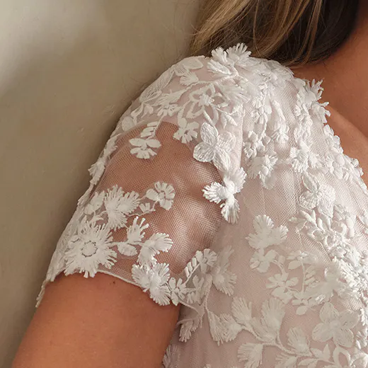 Winona Leigh floral lace sleeve detail