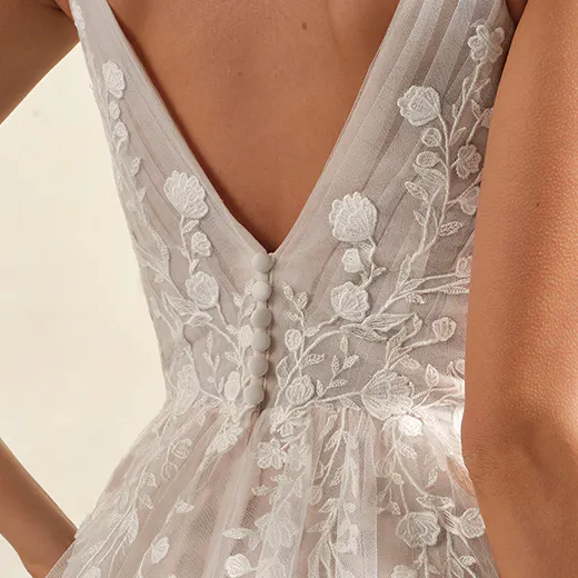 Maggie Sottero bridal gown back view with floral lace and V-neck