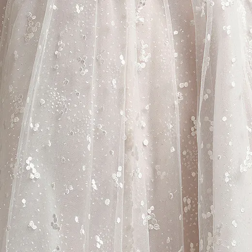 Fun Athlone bridal dress detail with dotted glitter tulle and floral design.