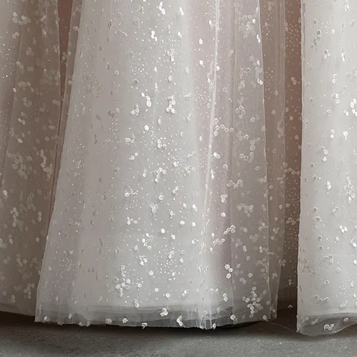 Dotted glitter tulle floral bridal skirt close-up.