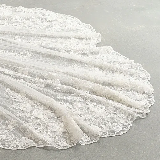 Chesney wedding dress lace train spread on floor