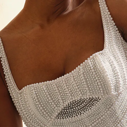 Maggie Sottero Luxe Danica close-up detail with pearl embellishments.