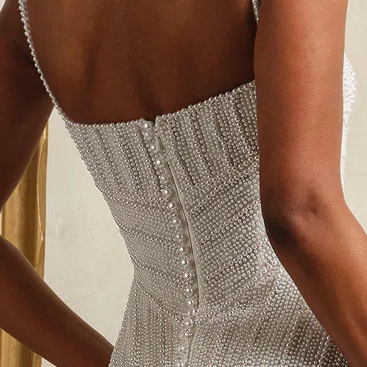 Maggie Sottero Danica back view, pearl beaded detailing with basque waist.