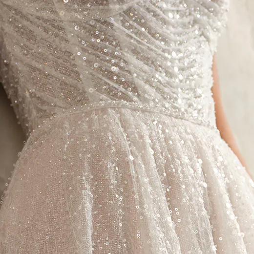 Maggie Sottero Monica off-the-shoulder gown close-up.