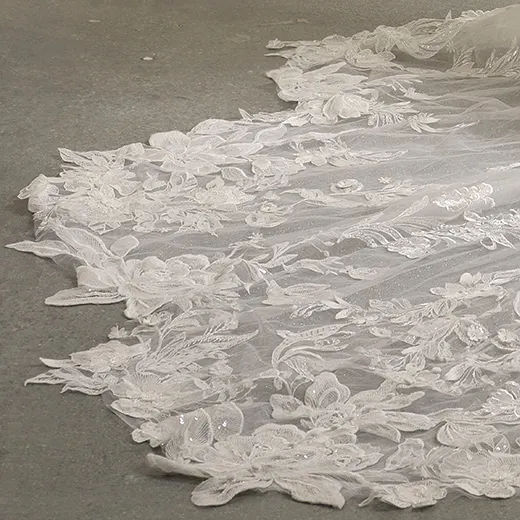 Nyjah scalloped sparkling lace wedding dress detail showing intricate floral lace pattern.