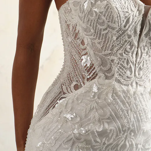 Beaded Sorrento strapless gown side view with intricate lace and sequins.
