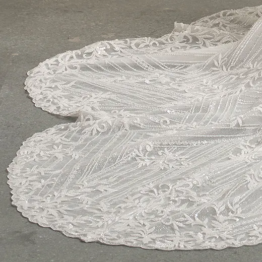 Beaded Sorrento lace wedding gown train detail.