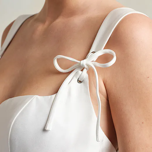 Maggie Sottero wedding dress strap detail with bow.
