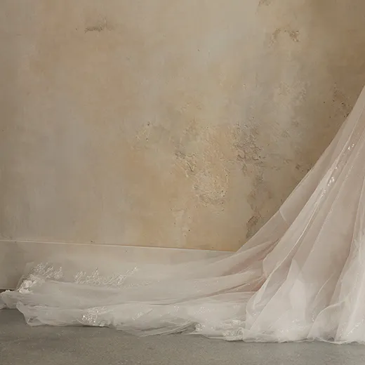 Romantic Wicklow floral bridal gown skirt trailing on floor, side view.