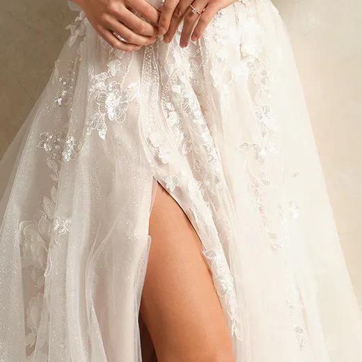 Rebecca Ingram 3-D floral bridal dress with side slit.
