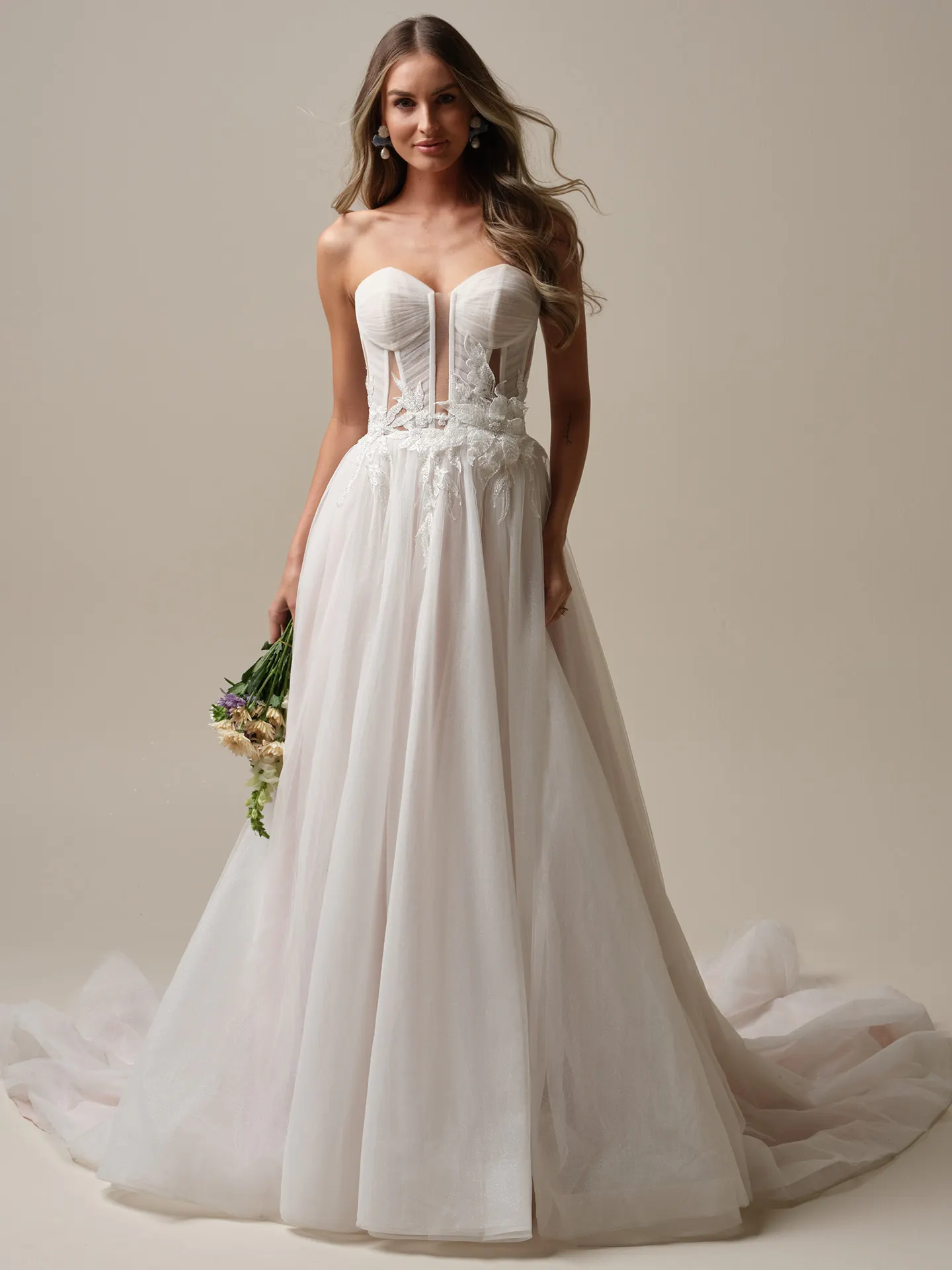 Maggie Sottero Arden front view A-line wedding dress with illusion bodice and pleated skirt.