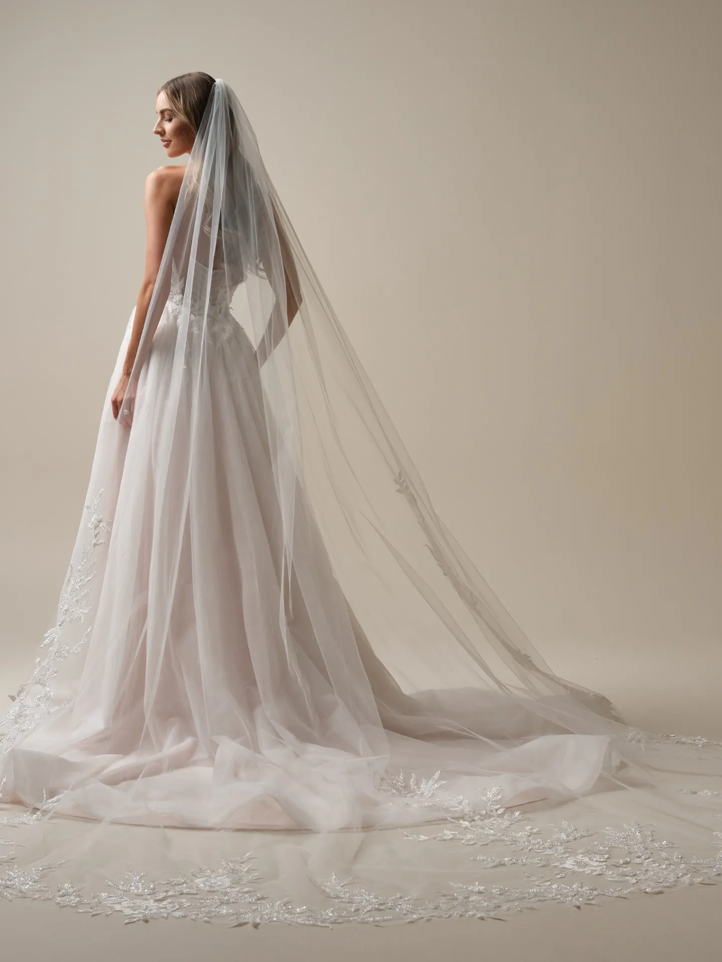 Maggie Sottero Arden back view long veil and flowy A-line wedding dress