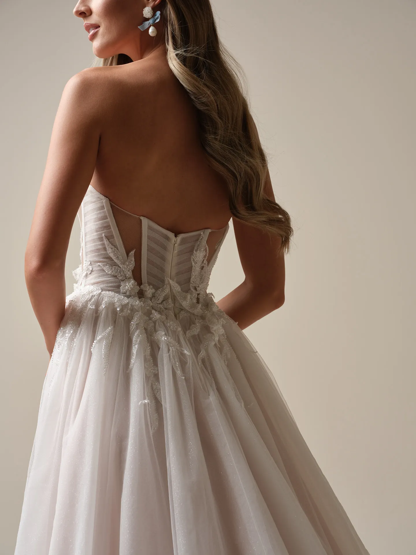 Maggie Sottero Arden back view, illusion pleated A-line wedding dress.