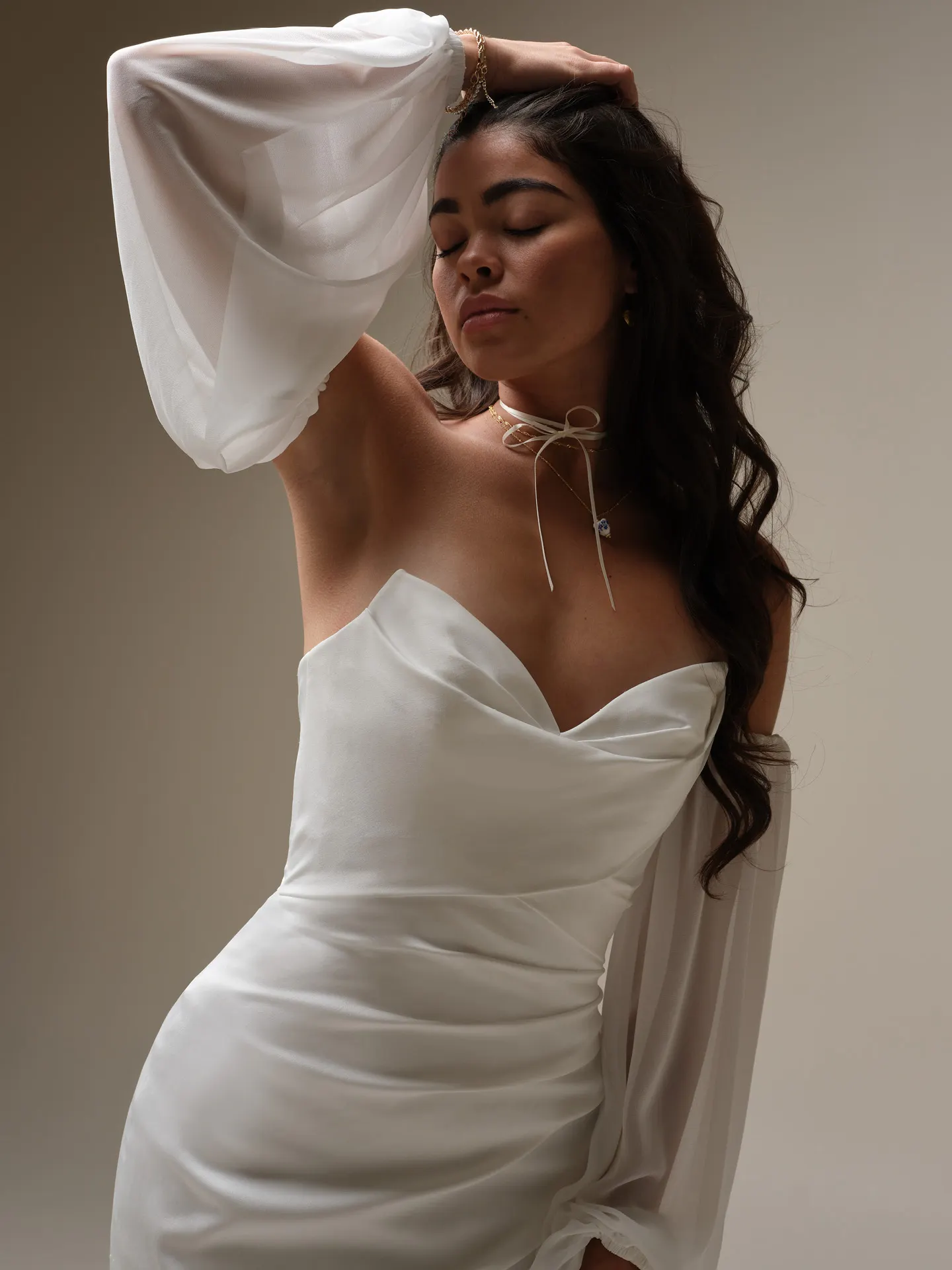 Maggie Sottero Camille side view, off-the-shoulder chiffon bishop sleeves.