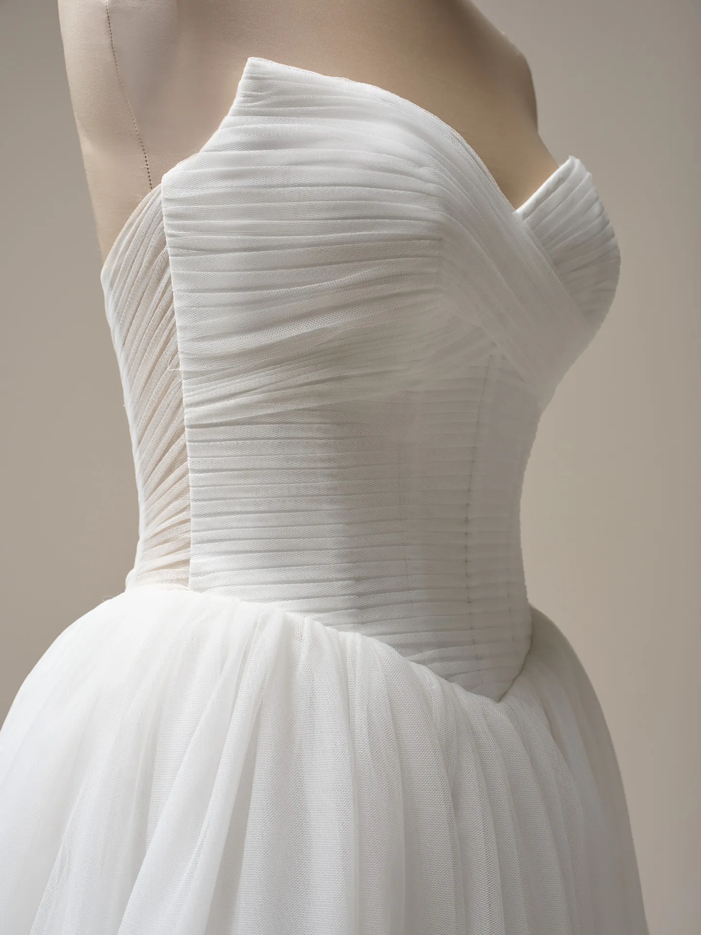 Evan pleated keyhole ball gown side view Maggie Sottero