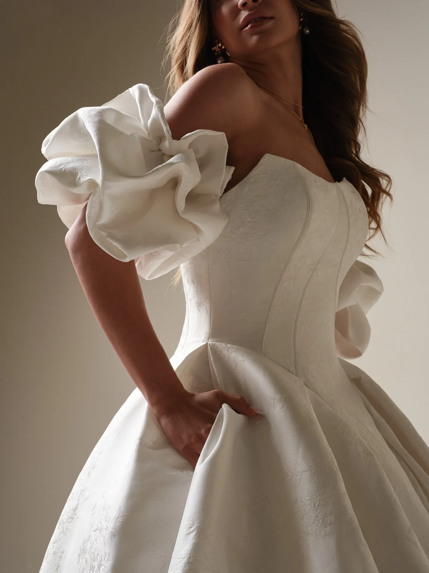 Maggie Sottero Fortune Marie side view, princess ball gown with puff sleeves.