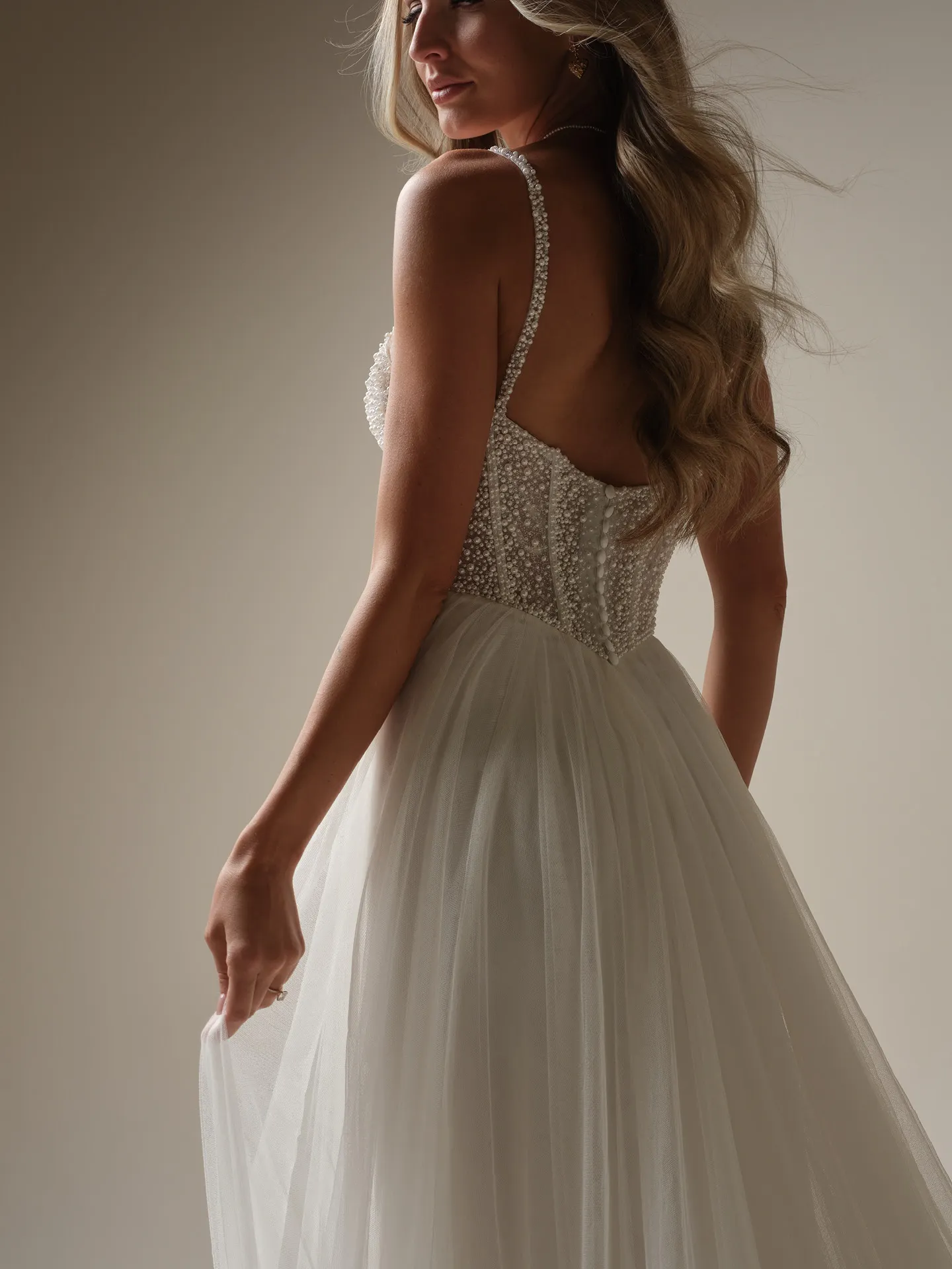 Gretchen side view; pearl bodice tulle A-line wedding dress, Maggie Sottero
