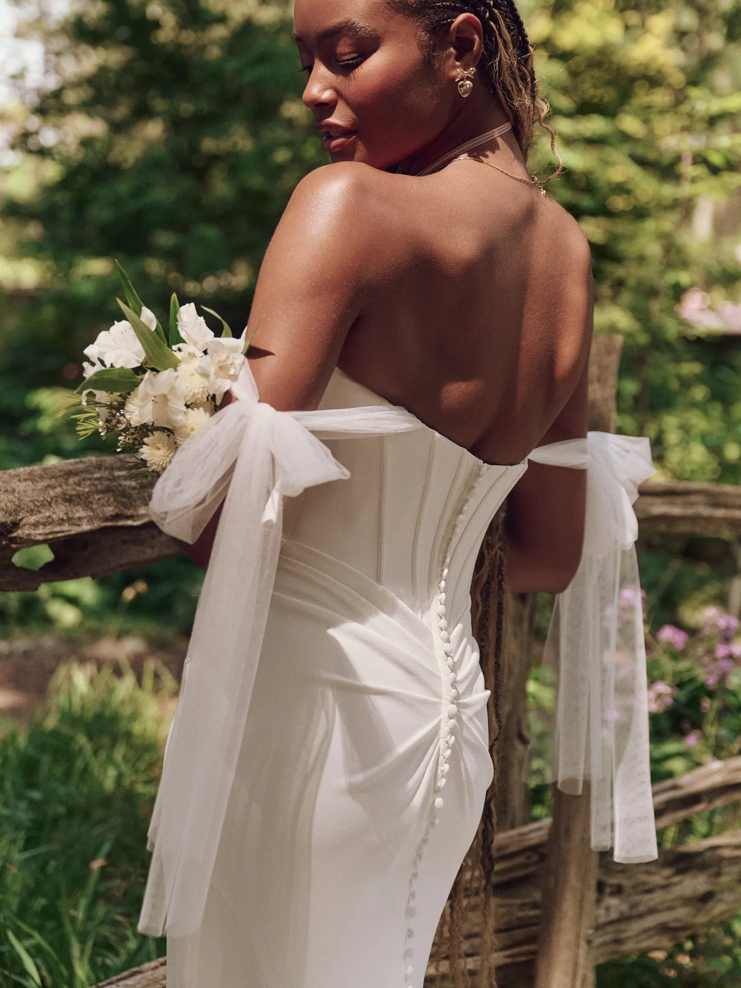 Maggie Sottero Jace back view, exposed boning crepe sheath wedding dress.
