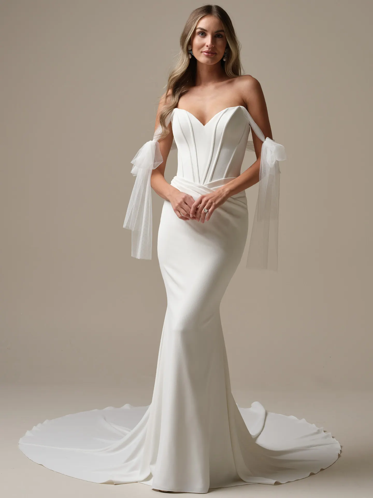 Maggie Sottero Jace front view crepe sheath wedding dress with exposed boning.