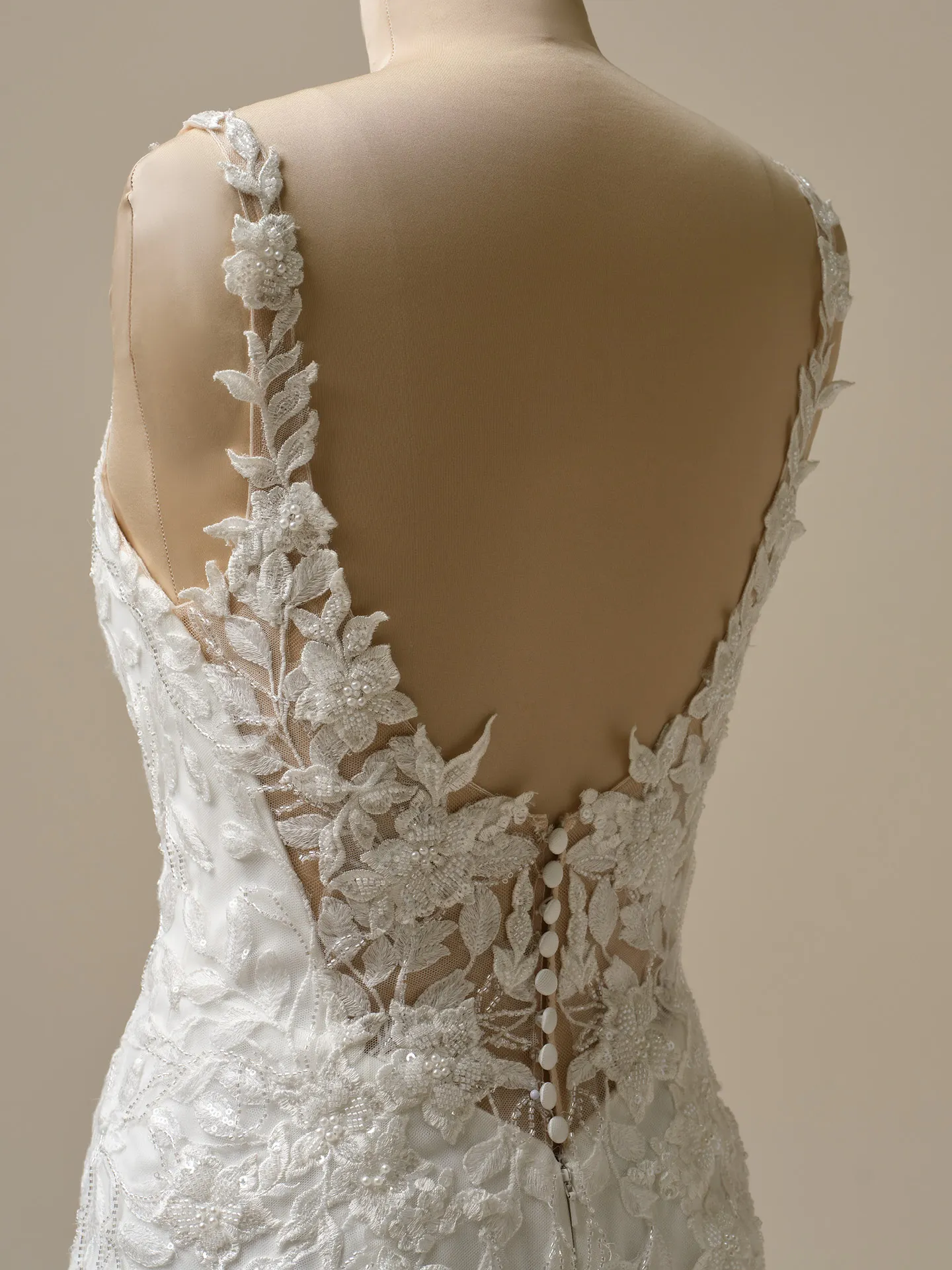 Keegan illusion back with lace floral detail and buttons Maggie Sottero mermaid gown back view