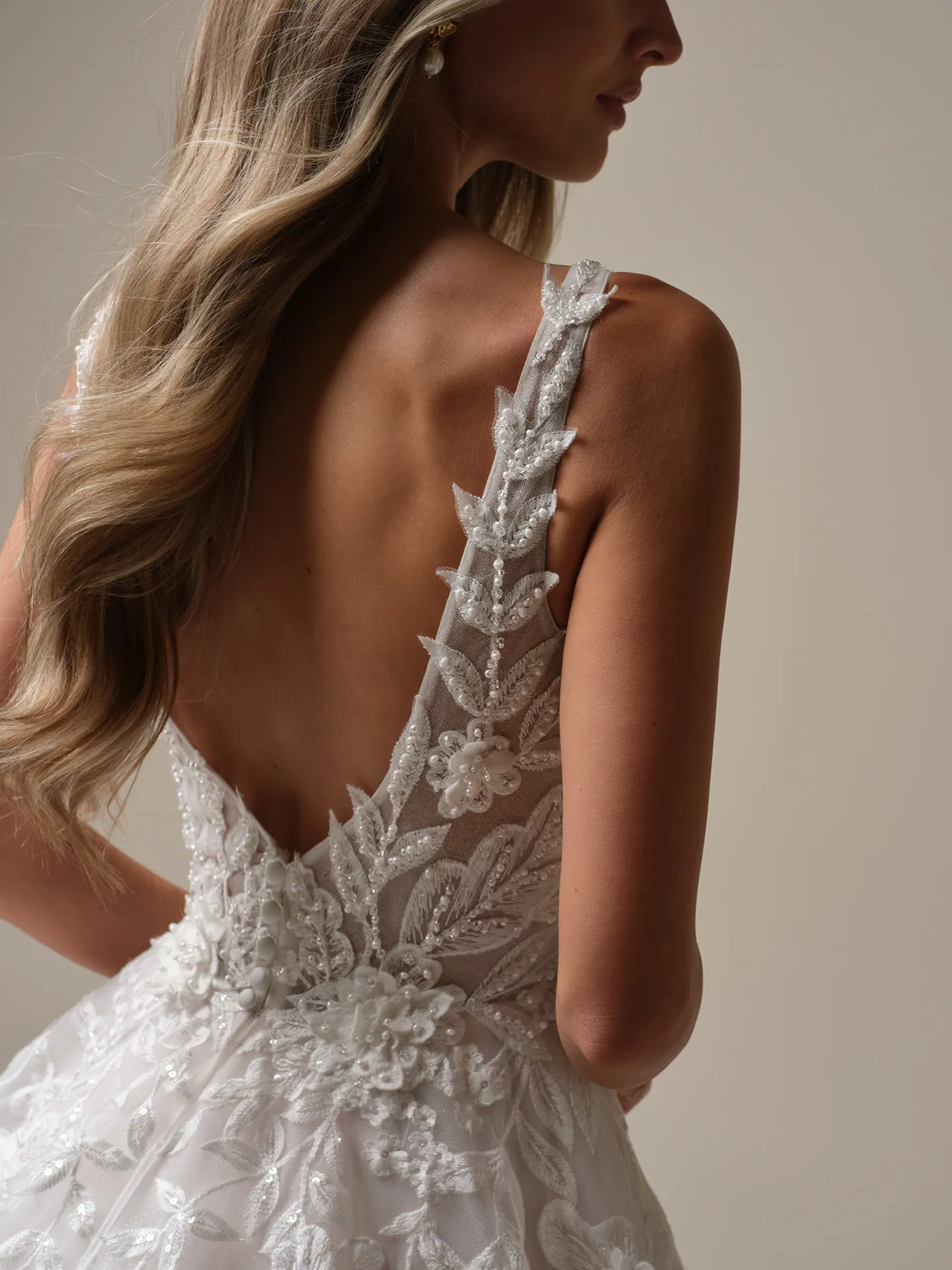 Maggie Sottero Magnolia back view wedding dress with 3-D lace and floral detailing