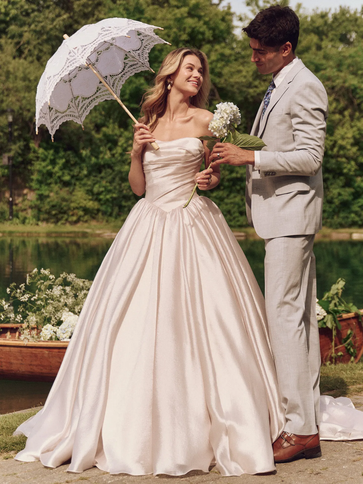 Maggie Sottero Paris front view bridal dress with basque waist and full skirt, outdoor setting