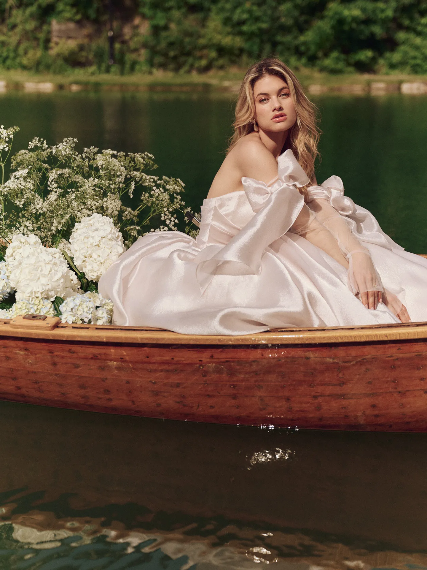 Maggie Sottero Paris dress, off-shoulder, boat scene with flowers.