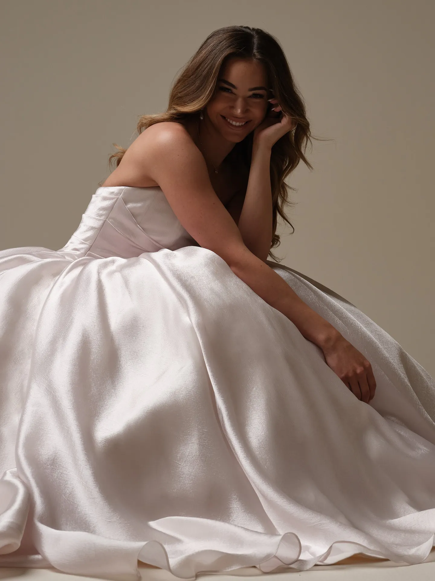 Maggie Sottero Paris ballgown side view with asymmetrical basque waist.