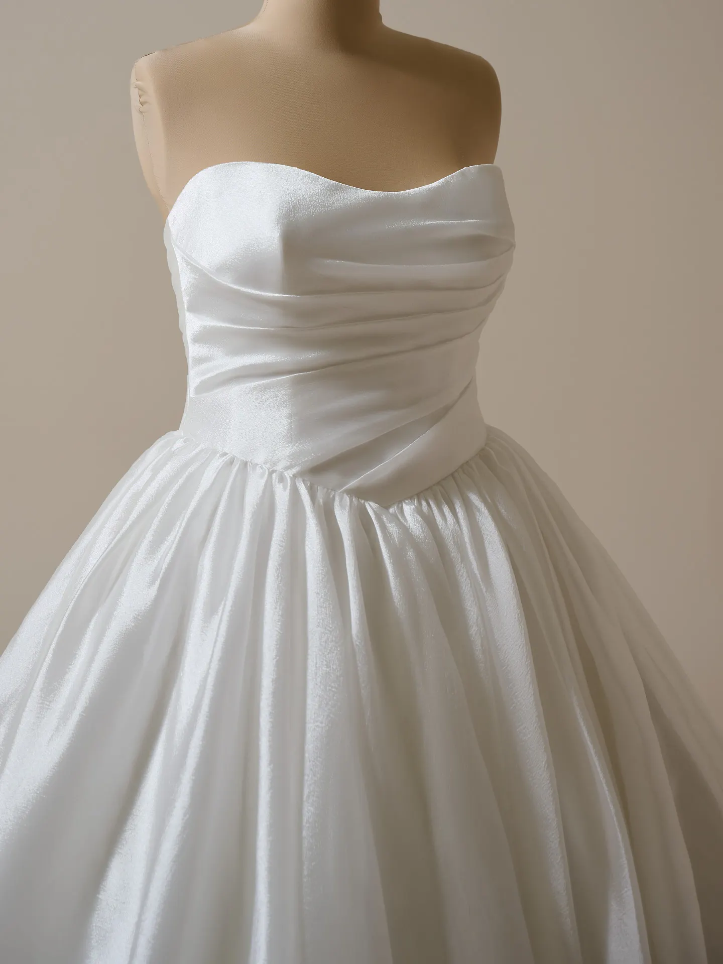 Maggie Sottero Paris front view strapless ballgown with asymmetrical waist