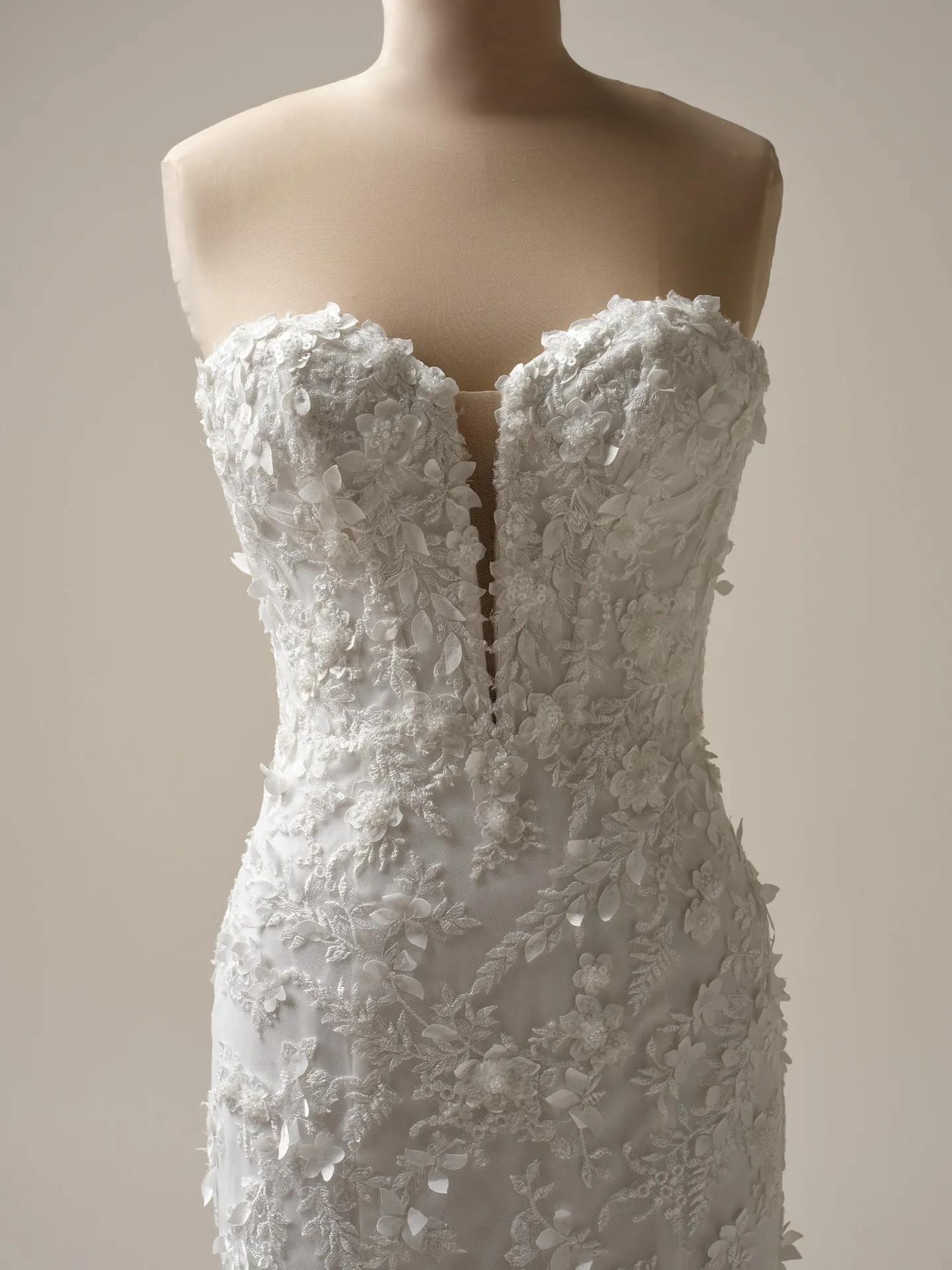Maggie Sottero Roberta front view lace fit-and-flare wedding dress with exposed boning.