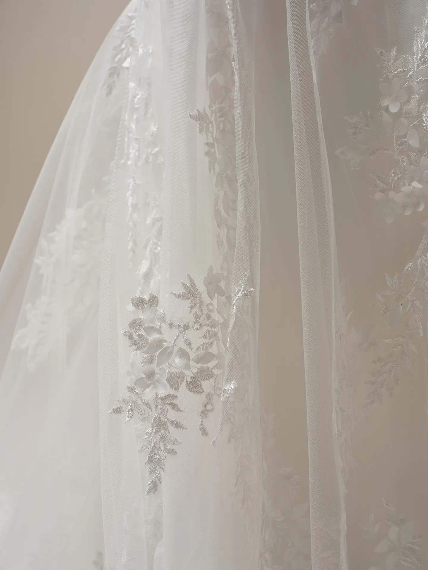 Maggie Sottero Roberta lace detail fabric fitting.