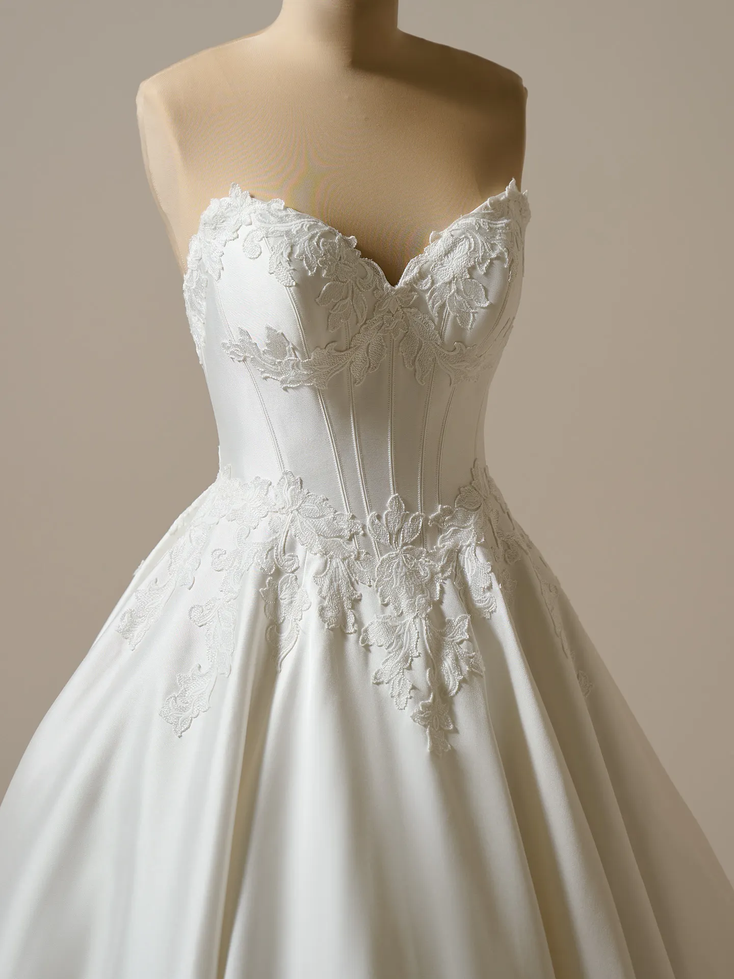 Maggie Sottero Serafina front view satin ball gown with lace detailing.
