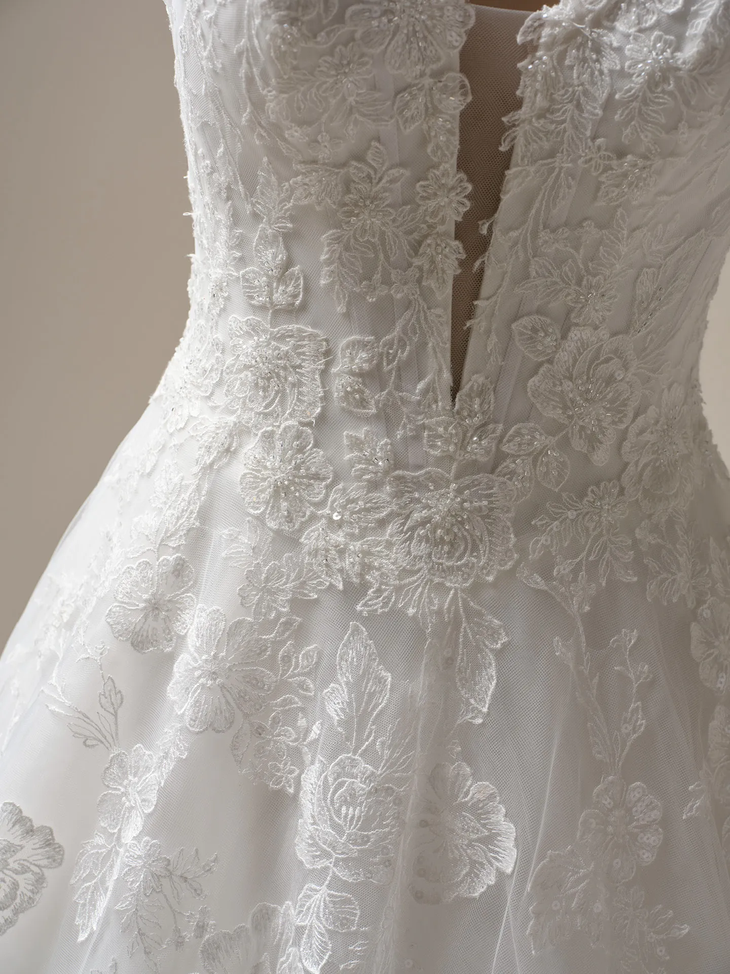 Maggie Sottero Skylar lace detail, front view, A-line bridal gown.