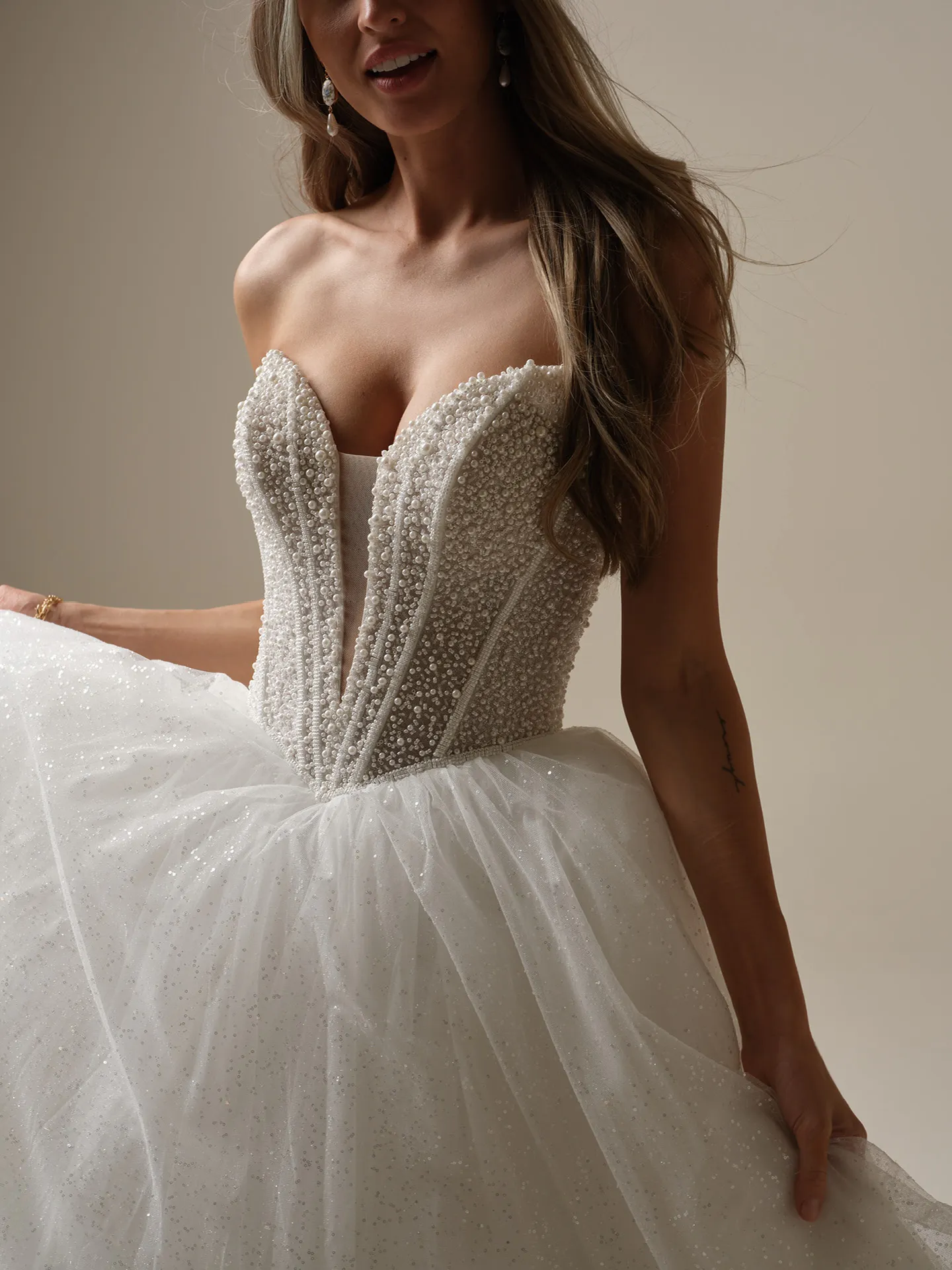 Maggie Sottero Tina Lane pearl beaded ballgown close-up front view.