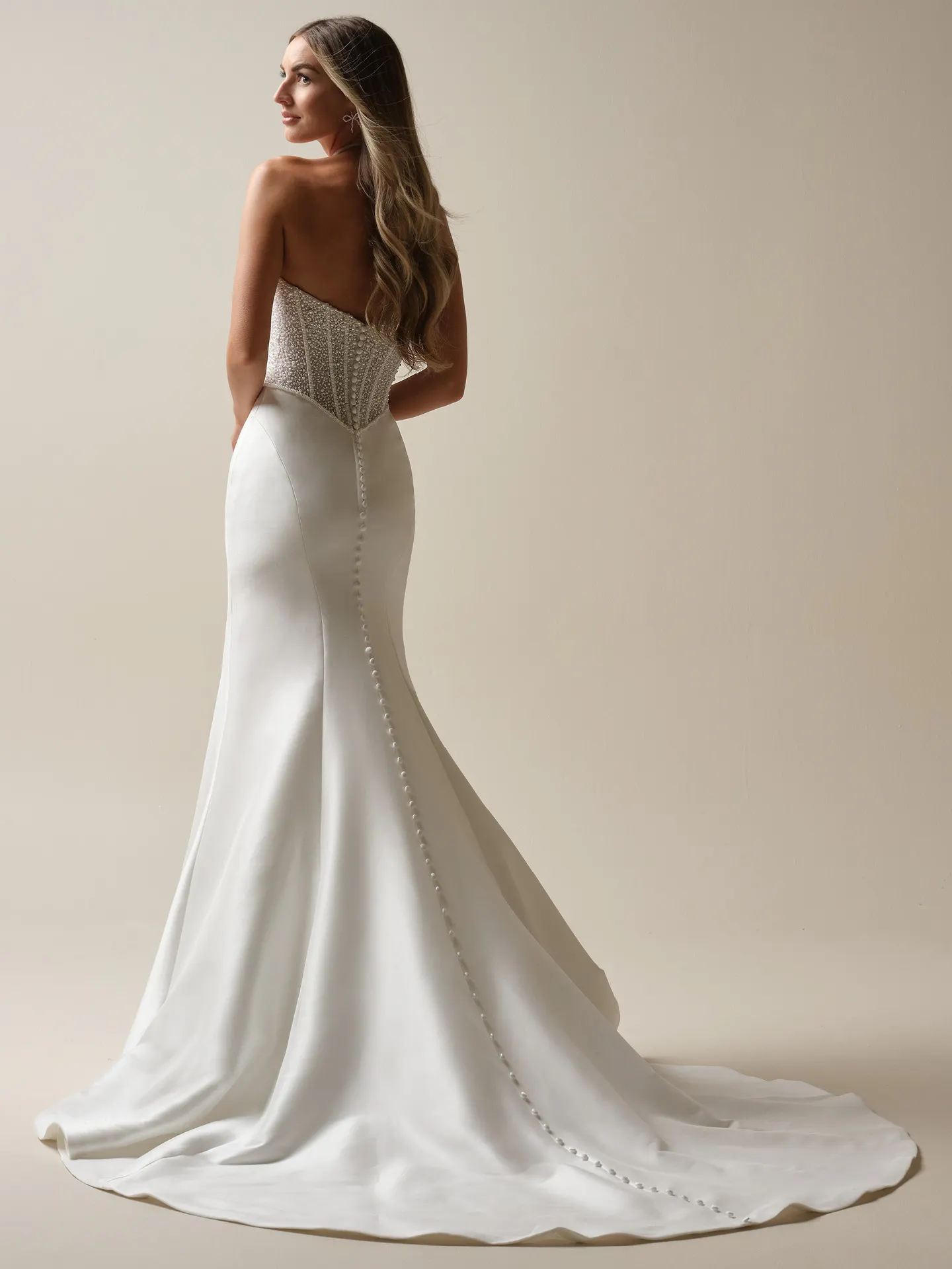 Maggie Sottero Tina Marie back view mermaid dress with beaded bodice and button detail
